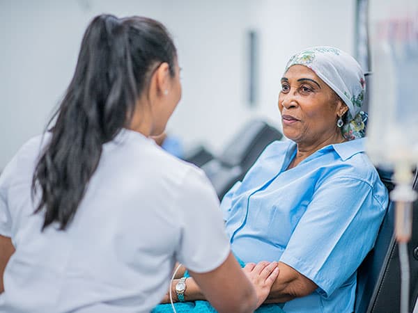 Doctor and cancer patient.