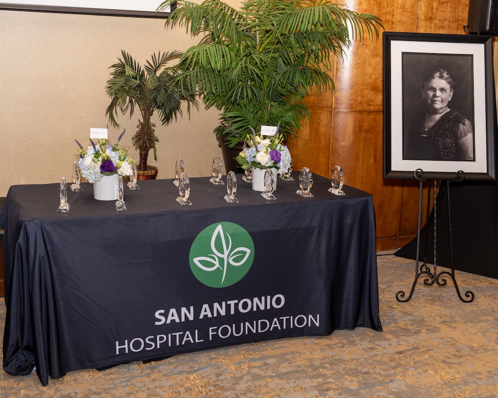 Table of awards with photo of Frances Mary Paul.