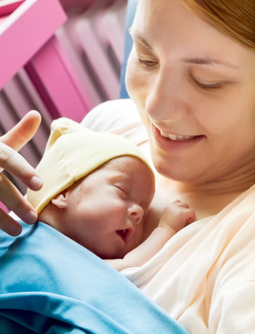 Mother in Hospital holding newborn