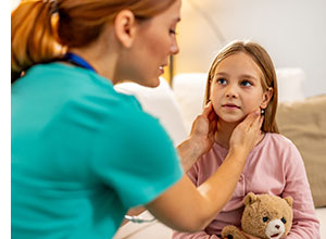 Doctor examining little girl.