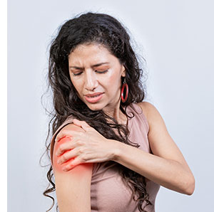 Woman looking at shoulder rash.